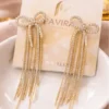 Pavira Luxe Crystal Bow Tassel Earrings