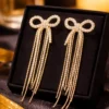Pavira Luxe Crystal Bow Tassel Earrings