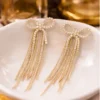 Pavira Luxe Crystal Bow Tassel Earrings