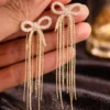Pavira Luxe Crystal Bow Tassel Earrings