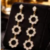 Pavira Luxe Triple Halo Zircon Drop Earrings