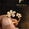 Gold diamond ring on black satin1 Pavira Blossom Dual Flower Ring