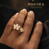 Gold diamond ring on black satin2 Pavira Blossom Dual Flower Ring
